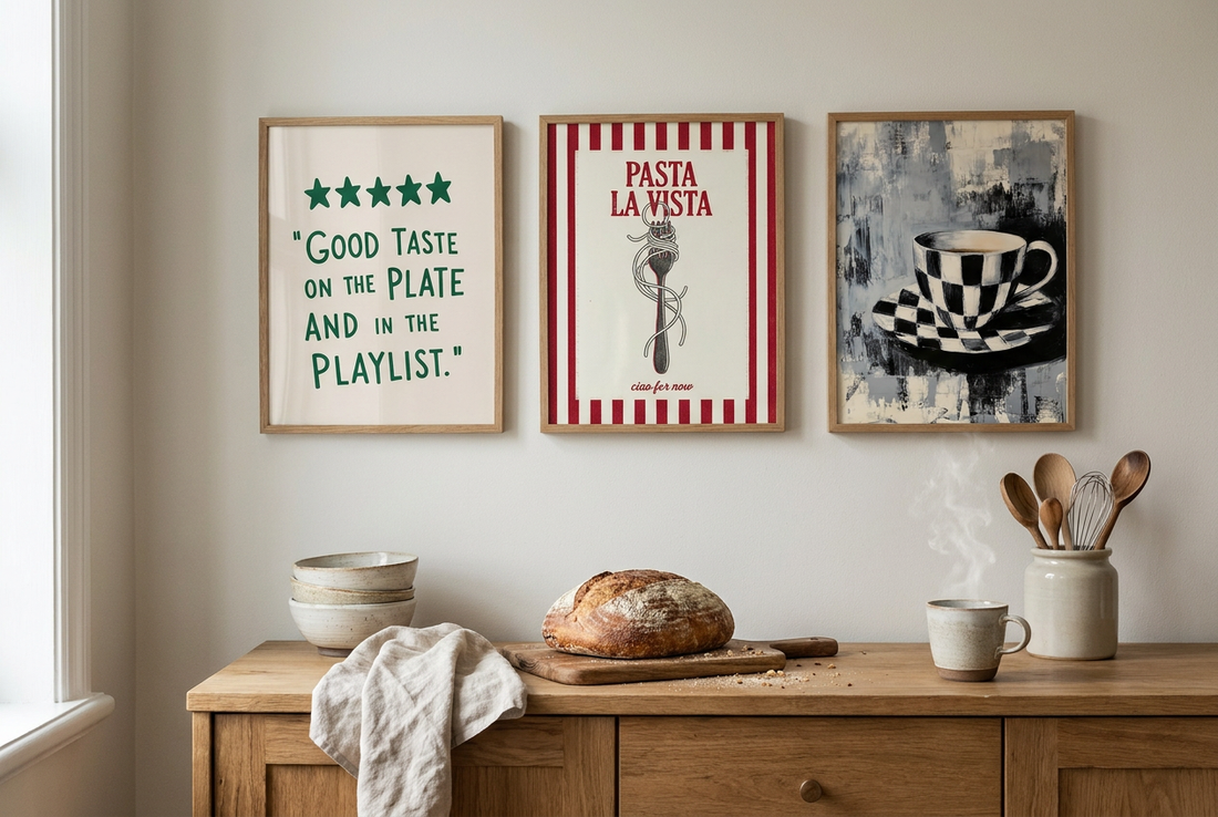 Three kitchen art prints above an oak sideboard with sourdough and ceramics