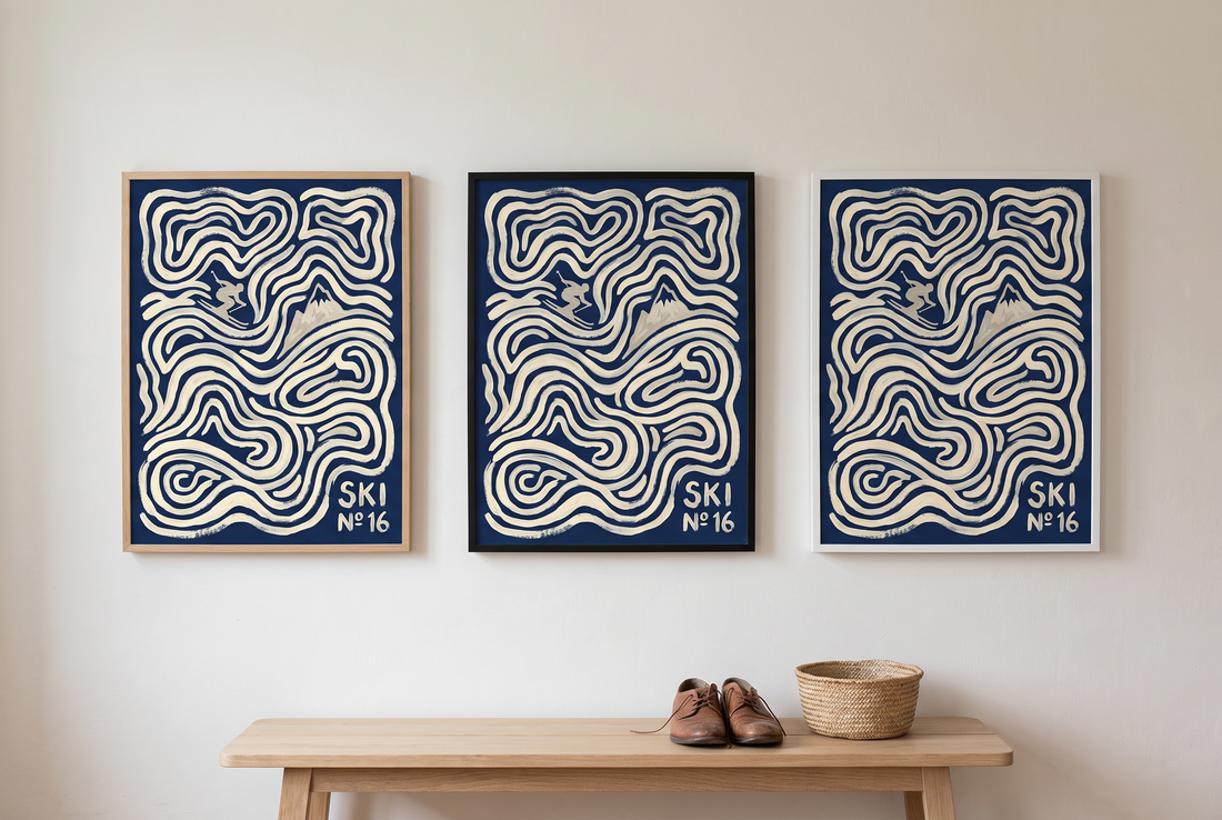 The same ski print hung three times side by side in an oak frame, a black frame and a white frame
