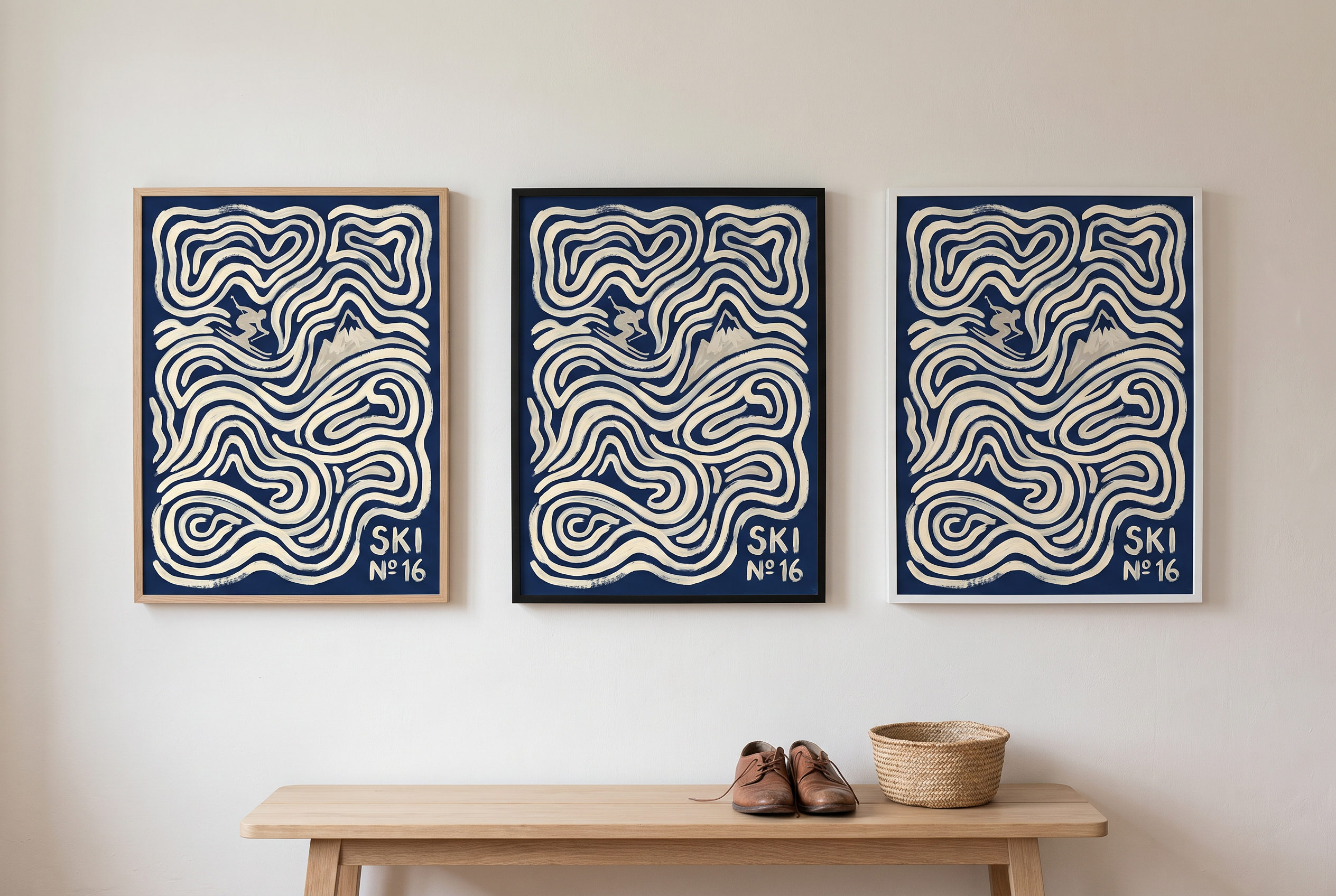 The same ski print hung three times side by side in an oak frame, a black frame and a white frame