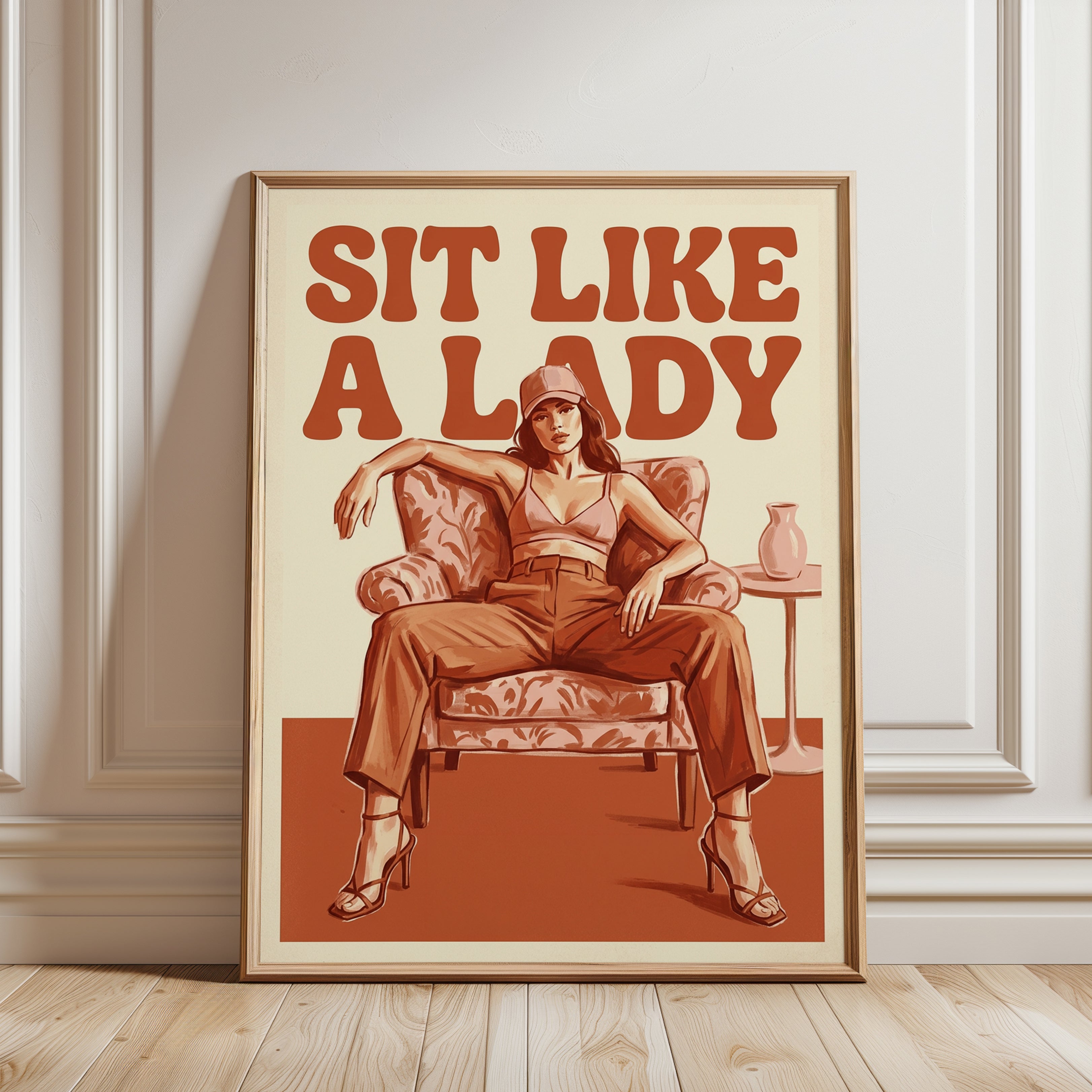 Sit Like A Lady Poster: Retro Feminist Art in Burnt Orange Tones - framed detail